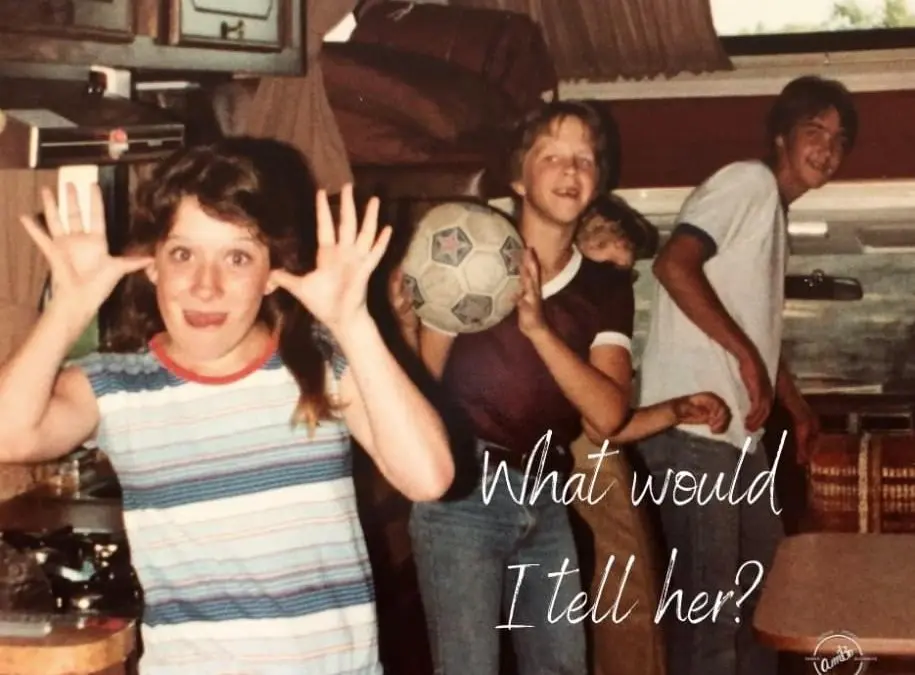 A group of people standing around in a room.
