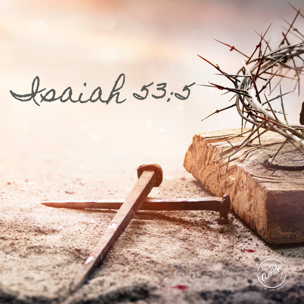 A pair of nails and a piece of wood with the word isaiah 5 3. 5 written on it