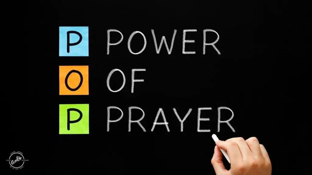 A person writing on the board power of prayer