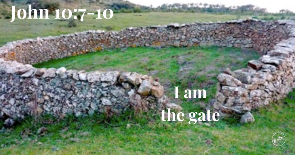 A stone wall with the words " i am the gate ".