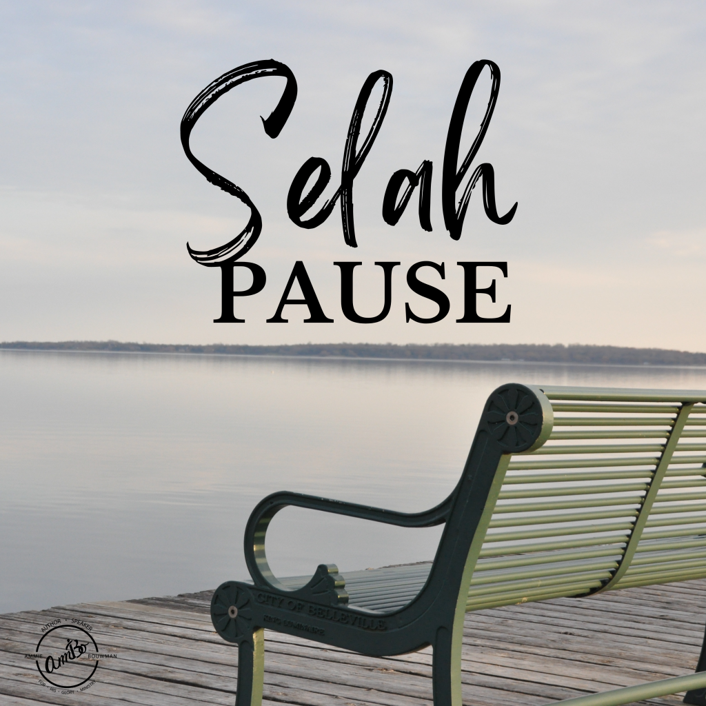 A bench and water with the words selah pause written above it.