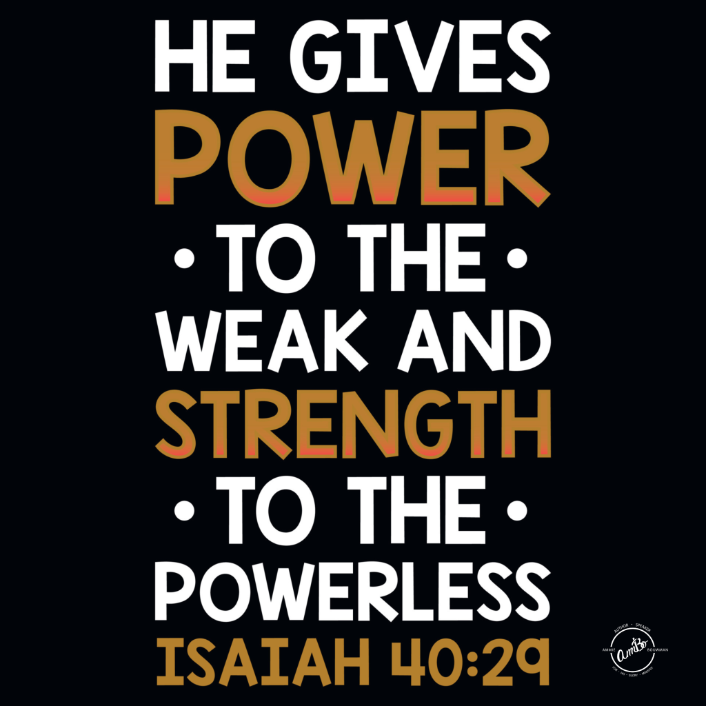 A black shirt with the words " he gives power to the weak and strength to the powerless."