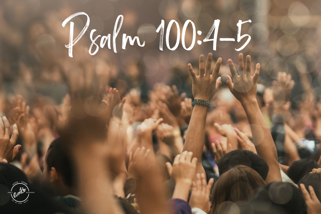 A crowd of people with their hands raised in the air.