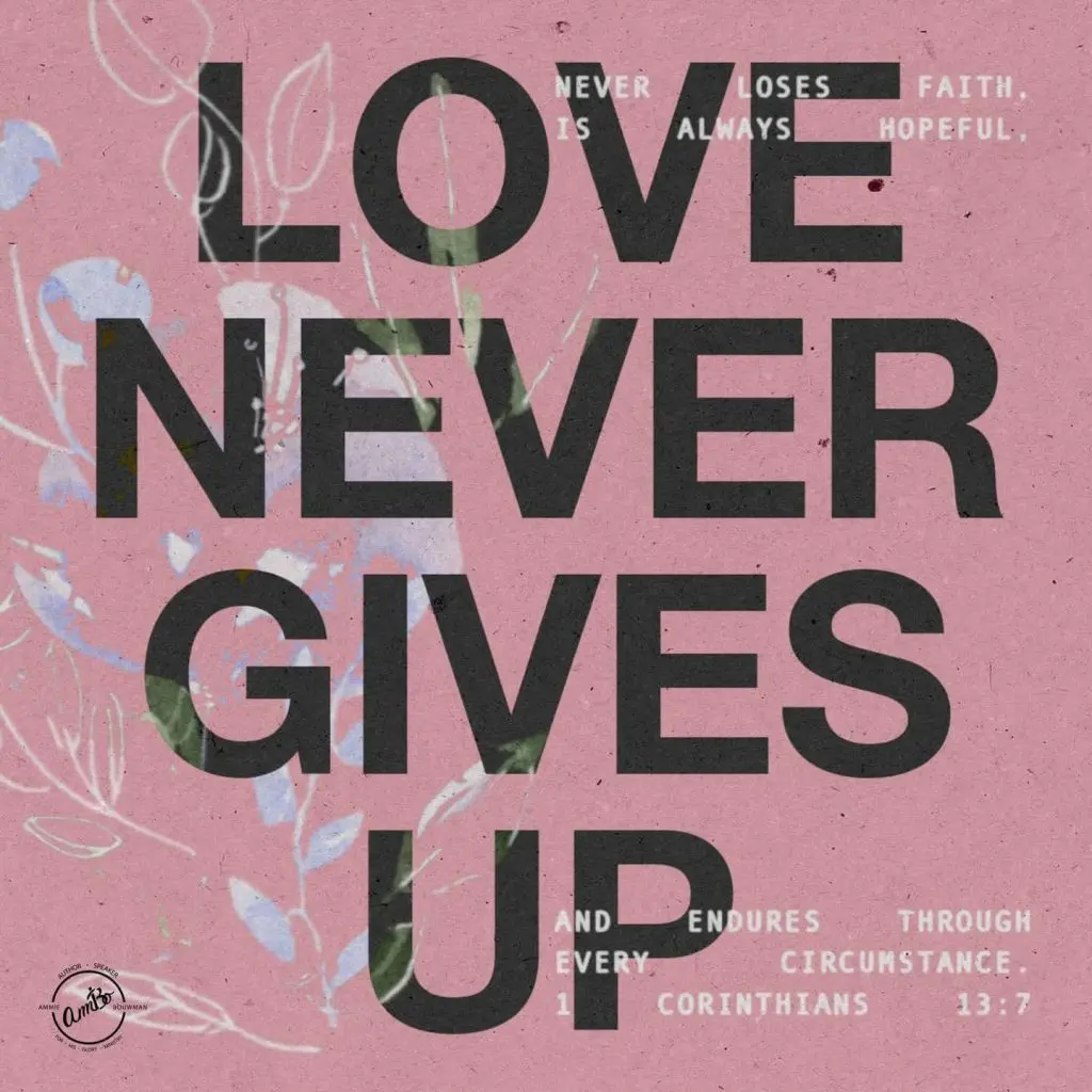 A pink background with the words love never gives up.