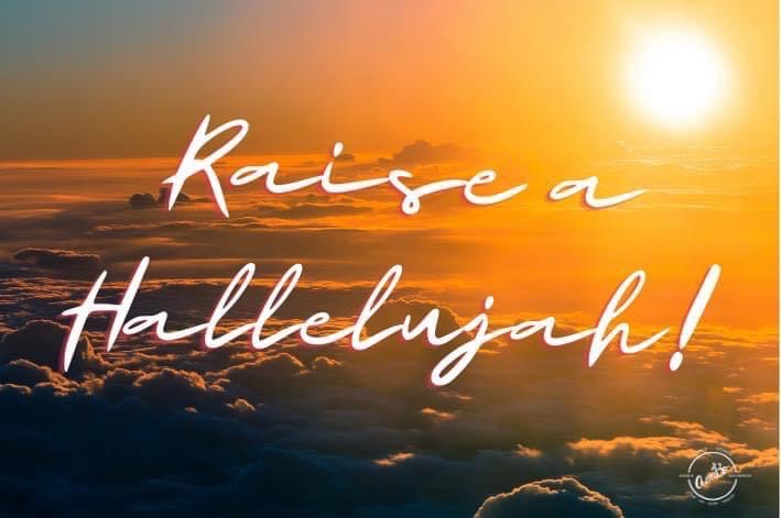 A sunset with the words " raise a hallelujah ".