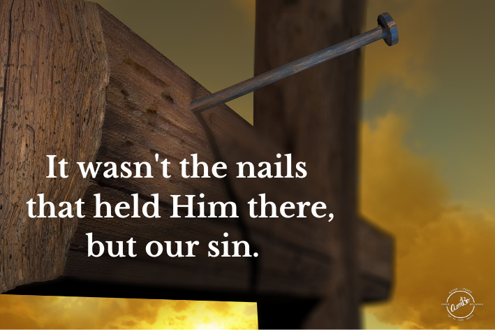 A cross with a nail stuck in it and the words " jesus wasn 't the nails that held him there, but our sin ".