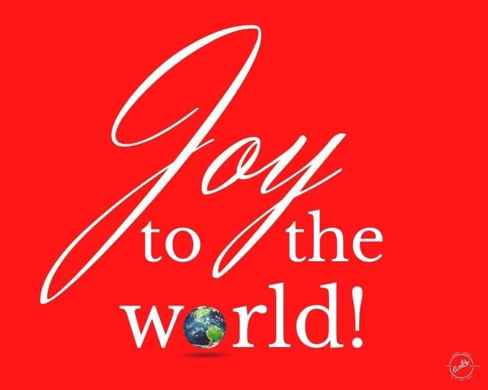 A red background with the words joy to the world