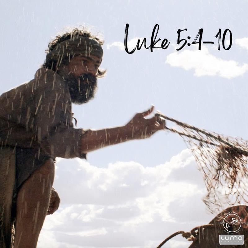 A man holding onto a fishing net with the words luke 5 : 4-1 0 written on it.