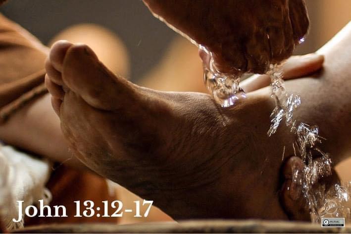 A person washing their feet with water.